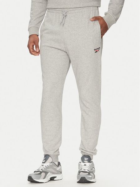 Reebok Spodnie dresowe 100221804 Szary Regular Fit. Szare spodnie dresowe męskie Reebok, bez wzorów, z dresówki. Za 119.99 zł.