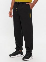 Calvin Klein Spodnie dresowe Grid Logo K10K112430 Czarny Relaxed Fit. Czarne spodnie dresowe męskie Calvin Klein, bez wzorów, z bawełny. Za 319.99 zł.