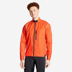 Kurtka przeciwdeszczowa rowerowa MTB Rockrider Comfort 500. Czerwone kurtki treningowe męskie ROCKRIDER, l, bez wzorów, z materiału, bez kaptura, rowerowe. Za 159.99 zł.