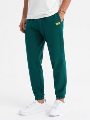 Klasyczne dresowe spodnie unisex ze ściągaczami ciemnozielone V17 OU-PSBC-0100 XS/S. Zielone długie spodnie sportowe męskie Ombre, z dresówki, bez obcasa, bez zapięcia. Za 302.57 zł.