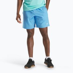 Spodenki Reebok Wor Woven. Niebieskie szorty sportowe męskie REEBOK FITNESS, bez wzorów, sportowe. Za 109.99 zł.