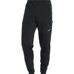 Nike Performance PANT RUN DIVISION Spodnie treningowe black/reflective silver. Długie spodnie sportowe męskie Nike Performance. W wyprzedaży za 342.30 zł.