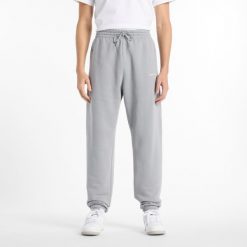 Spodnie męskie New Balance MP51505YST – szare. Szare spodnie dresowe męskie New Balance, bez wzorów, z bawełny. Za 169.99 zł.