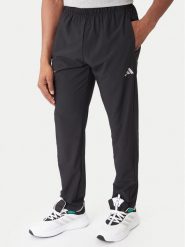 Adidas Spodnie dresowe Training Essentials Holiday JM5441 Czarny Regular Fit. Czarne długie spodnie sportowe męskie ADIDAS, bez wzorów, z dresówki. Za 258.99 zł.