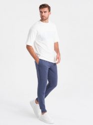 Spodnie dresowe męskie z tkaniny ottoman - ciemnoniebieskie V2. Niebieskie spodnie dresowe męskie Ombre Clothing, bez wzorów, z bawełny. W wyprzedaży za 39.99 zł.