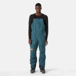 Spodnie narciarskie z szelkami i kieszenią cargo Helly Hansen Sogn. Zielone spodnie narciarskie i snowboardowe męskie Helly Hansen, bez wzorów, narciarskie. Za 1,037.00 zł.
