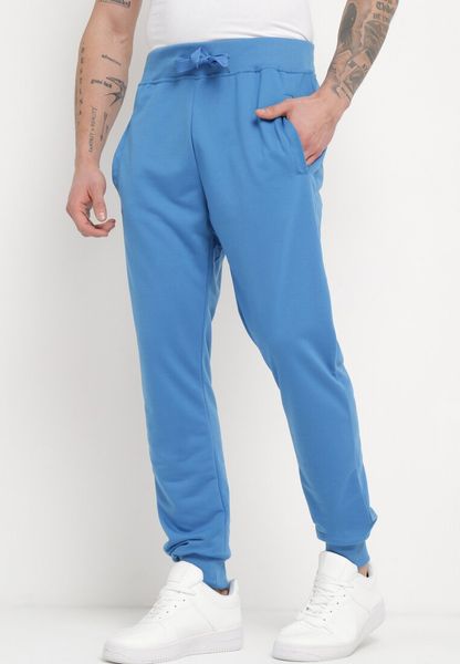 Niebieskie Spodnie Dresowe z Wiązaniem w Pasie z Wyższym Stanem Aricasa. Niebieskie spodnie dresowe męskie Born2be, bez wzorów, z dresówki. Za 34.99 zł.
