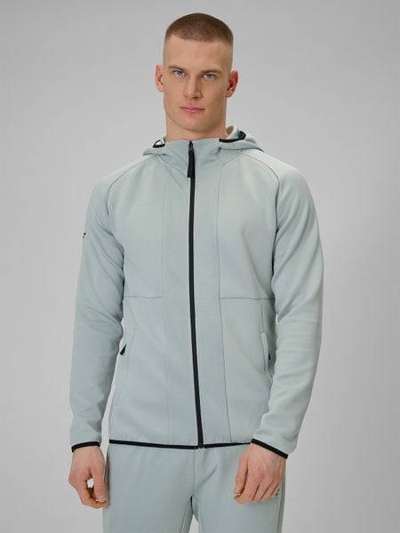 4F Bluza treningowa regular szybkoschnąca męska - miętowa L. Niebieskie bluzy rozpinane męskie 4f, l, bez wzorów, z materiału, bez ramiączek, bez kaptura. Za 269.99 zł.