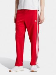 Adidas Spodnie dresowe adicolor Classics Firebird IJ7057 Czerwony Regular Fit. Czerwone spodnie dresowe męskie ADIDAS, bez wzorów, z dresówki. Za 179.99 zł.