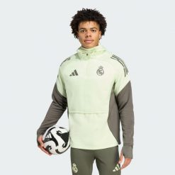 Bluza Real Madryt Tiro 25 Competition Winterized Top. Zielone bluzy nierozpinane męskie ADIDAS, xl, bez wzorów, z dresówki, sportowe, bez ramiączek, bez kaptura. Za 369.00 zł.