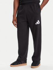 Adidas Spodnie dresowe Essentials JF3567 Czarny Loose Fit. Czarne spodnie dresowe męskie ADIDAS, bez wzorów, z bawełny. Za 179.99 zł.