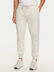Calvin Klein Jeans Spodnie dresowe Monologo J30J325658 Szary Regular Fit. Szare spodnie dresowe męskie Calvin Klein Jeans, bez wzorów, z bawełny. Za 339.99 zł.