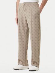 Guess Spodnie dresowe Z6GB03 K2850 Beżowy Regular Fit. Brązowe spodnie dresowe męskie Guess, z aplikacjami, z dresówki. Za 519.99 zł.