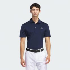 Koszulka polo Ultimate365 Solid. Niebieskie koszulki polo męskie ADIDAS, m, bez wzorów, z materiału, sportowe, bez kołnierzyka, bez ramiączek. Za 259.00 zł.