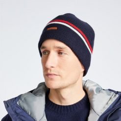 Czapka żeglarska Tribord Sailing 100 ocieplana. Białe czapki męskie TRIBORD, bez wzorów, z materiału, sportowe. W wyprzedaży za 29.99 zł.