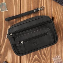 Saszetka męska czarna skórzana do ręki vintage Paolo Peruzzi T-130-HBL. Czarne saszetki męskie bez wzorów, ze skóry, eleganckie, do ręki. Za 129.00 zł.