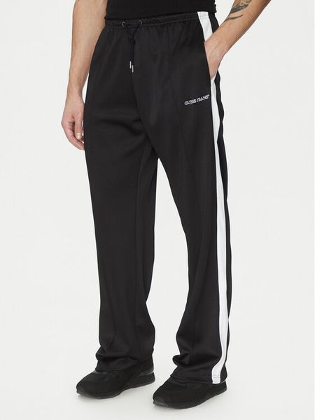 Guess Jeans Spodnie materiałowe 173615 Czarny Regular Fit. Czarne spodnie na co dzień męskie Guess Jeans, z aplikacjami, z jeansu. Za 219.99 zł.