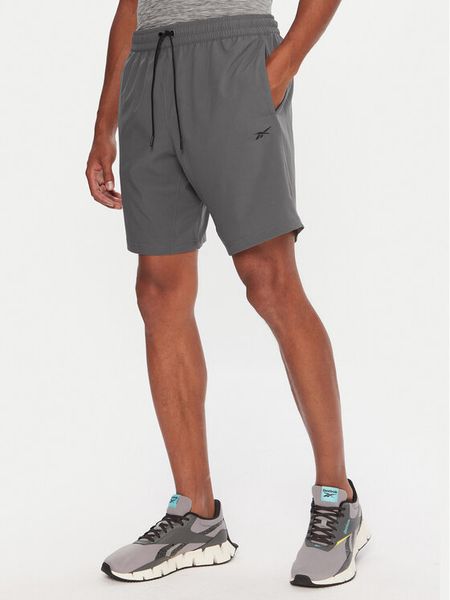 Reebok Szorty sportowe RK25181CCM Szary Regular Fit. Szare szorty sportowe męskie Reebok, bez wzorów, z syntetyku, sportowe. Za 99.99 zł.