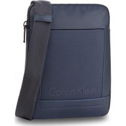 Saszetka CALVIN KLEIN - Caillou Flat Crosso K50K502835 422. Saszetki męskie marki Calvin Klein. W wyprzedaży za 239.00 zł.