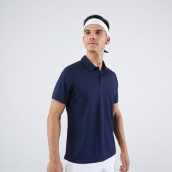 Koszulka polo do tenisa męska Artengo Essential. Niebieskie koszulki polo męskie KUIKMA, m, bez wzorów, z materiału, klasyczne, bez kołnierzyka, bez ramiączek. Za 29.99 zł.