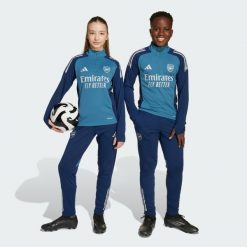 Spodnie treningowe Arsenal Tiro 25 Competition. Niebieskie długie spodnie sportowe męskie ADIDAS, bez wzorów, z dresówki, na fitness i siłownię. Za 259.00 zł.