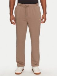 Puma Spodnie dresowe Ess 629651 Brązowy Relaxed Fit. Brązowe spodnie dresowe męskie Puma, bez wzorów, z bawełny. Za 169.99 zł.
