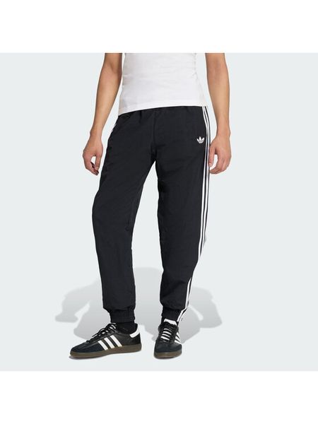 Adidas Spodnie dresowe Firebird Woven KE1371 Czarny Regular Fit. Czarne spodnie dresowe męskie ADIDAS, bez wzorów, z dresówki. Za 299.99 zł.