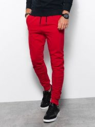 Spodnie męskie dresowe joggery - czerwone V5. Czerwone spodnie dresowe męskie Ombre Clothing, bez wzorów, z bawełny. W wyprzedaży za 39.99 zł.