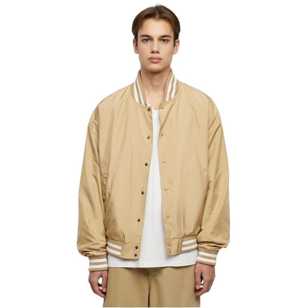 Kurtka Urban Classics College. Brązowe kurtki męskie Urban Classics, m, bez wzorów, bez ramiączek, bez kaptura. Za 242.50 zł.