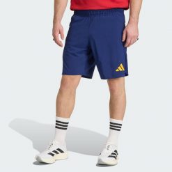 Szorty Hiszpania Tiro Travel. Niebieskie szorty sportowe męskie ADIDAS, bez wzorów, sportowe. Za 219.00 zł.