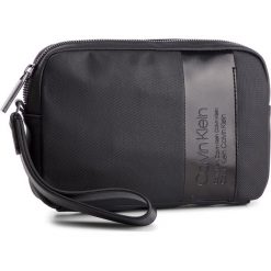 Saszetka CALVIN KLEIN - Elevated Compact Case K50K504448 001. Saszetki męskie marki Calvin Klein. W wyprzedaży za 239.00 zł.