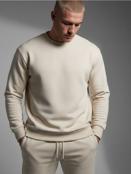 Bluza crewneck basic - kremowy. Białe bluzy nierozpinane męskie Sinsay, l, bez wzorów, bez ramiączek, bez kaptura. Za 29.99 zł.