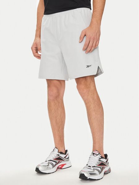 Reebok Szorty sportowe Strength 100075594 Szary Regular Fit. Szare szorty sportowe męskie Reebok, bez wzorów, z syntetyku, sportowe. Za 189.99 zł.