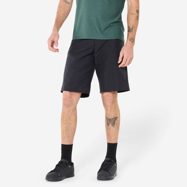 Szorty rowerowe MTB Rockrider Essential. Czarne szorty sportowe męskie ROCKRIDER, bez wzorów, z materiału, sportowe. Za 79.99 zł.