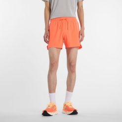 Spodenki męskie New Balance MS41286AAE – pomarańczowe. Brązowe szorty sportowe męskie New Balance, bez wzorów, z materiału, sportowe. Za 279.99 zł.