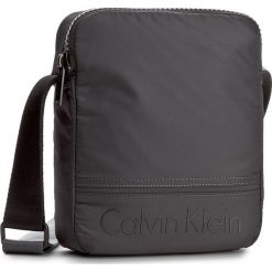Saszetka CALVIN KLEIN - Matthew Reporter K50K502899 009. Saszetki męskie marki Calvin Klein. W wyprzedaży za 219.00 zł.