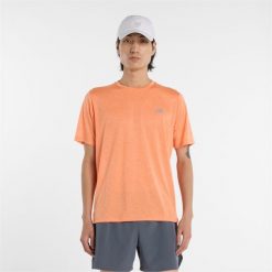 Koszulka męska New Balance MT41253AAE – pomarańczowa. Brązowe t-shirty sportowe męskie New Balance, m, bez wzorów, z materiału, sportowe, bez ramiączek. Za 199.99 zł.