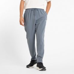 Spodnie męskie New Balance MP51904GT – szare. Szare spodnie na co dzień męskie New Balance, bez wzorów, z materiału, sportowe. Za 199.99 zł.