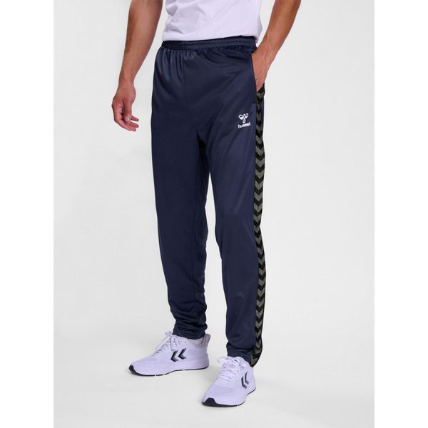 Spodnie dresowe polyesterowe Hummel Authentic. Niebieskie długie spodnie sportowe męskie HUMMEL, bez wzorów, z dresówki, do piłki nożnej. Za 193.50 zł.