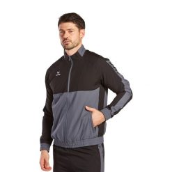 Kurtka prezentacyjna Erima Six Wings. Czarne kurtki męskie Erima, m, bez wzorów, sportowe, bez ramiączek, bez kaptura. W wyprzedaży za 242.00 zł.