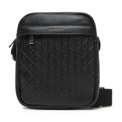 Saszetka Calvin Klein. Czarne saszetki męskie Calvin Klein, bez wzorów, młodzieżowe, małe. Za 289.99 zł.