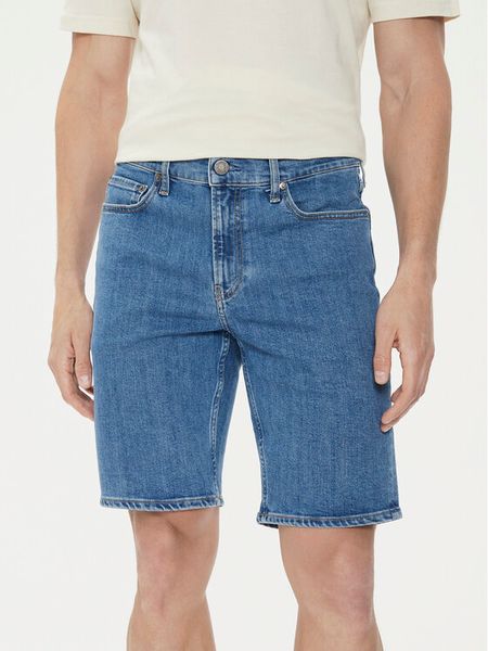 Calvin Klein Szorty jeansowe K10K112941 Niebieski Slim Fit. Niebieskie szorty męskie Calvin Klein, bez wzorów, z bawełny. Za 239.99 zł.