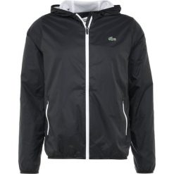 Lacoste Sport TENNIS WIND JACKET Kurtka sportowa black/white. Kurtki treningowe męskie marki Lacoste Sport. Za 669.00 zł.