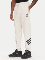 Adidas Spodnie dresowe Star Wars The Mandalorian™ JI5723 Beżowy Regular Fit. Brązowe spodnie dresowe męskie ADIDAS, bez wzorów, z bawełny. Za 219.99 zł.