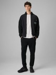 4F Spodnie dresowe joggery męskie - czarne L. Czarne długie spodnie sportowe męskie 4f, bez wzorów, z dresówki. W wyprzedaży za 119.99 zł.