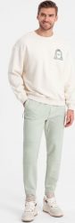 Ombre Męskie spodnie joggery dresowe na gumce z przeszyciami miętowe V3 OM-PASK-0142 XXL. Zielone długie spodnie sportowe męskie Ombre, bez wzorów, z dresówki. Za 59.99 zł.