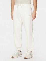Guess Spodnie dresowe Z4YB00 KAIJ1 Écru Relaxed Fit. Spodnie dresowe męskie Guess, z aplikacjami, z bawełny. Za 179.99 zł.