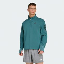Kurtka Own The Run Winterized. Niebieskie kurtki męskie ADIDAS, xl, bez wzorów, bez ramiączek, bez kaptura. Za 439.00 zł.