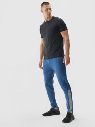 4F Spodnie treningowe szybkoschnące męskie - niebieskie S. Niebieskie długie spodnie sportowe męskie 4f, bez wzorów, z dzianiny, na fitness i siłownię. W wyprzedaży za 79.99 zł.