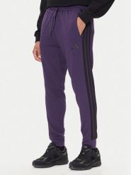 Adidas Spodnie dresowe Essentials 3-Stripes JX0750 Fioletowy Regular Fit. Fioletowe spodnie dresowe męskie ADIDAS, bez wzorów, z bawełny. Za 189.99 zł.